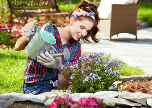 Gardener planning a garden layout in Newington