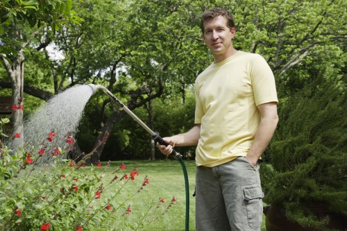 Professional gardener tending to plants